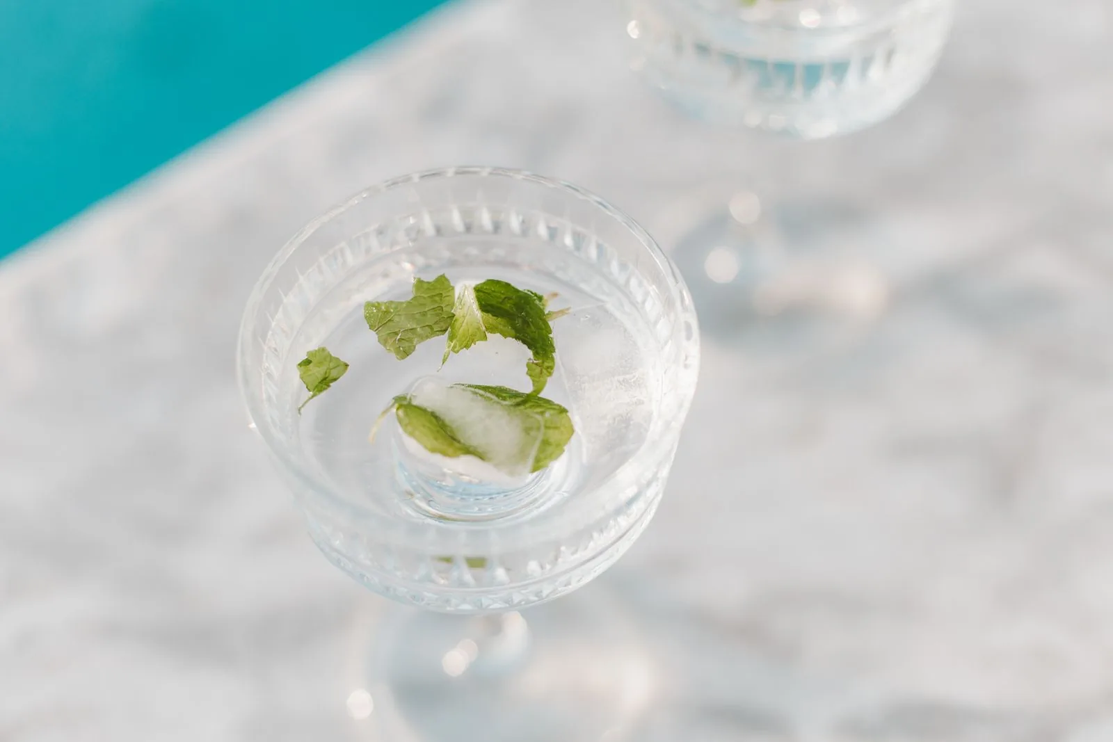 Glass of ice water with fresh mint