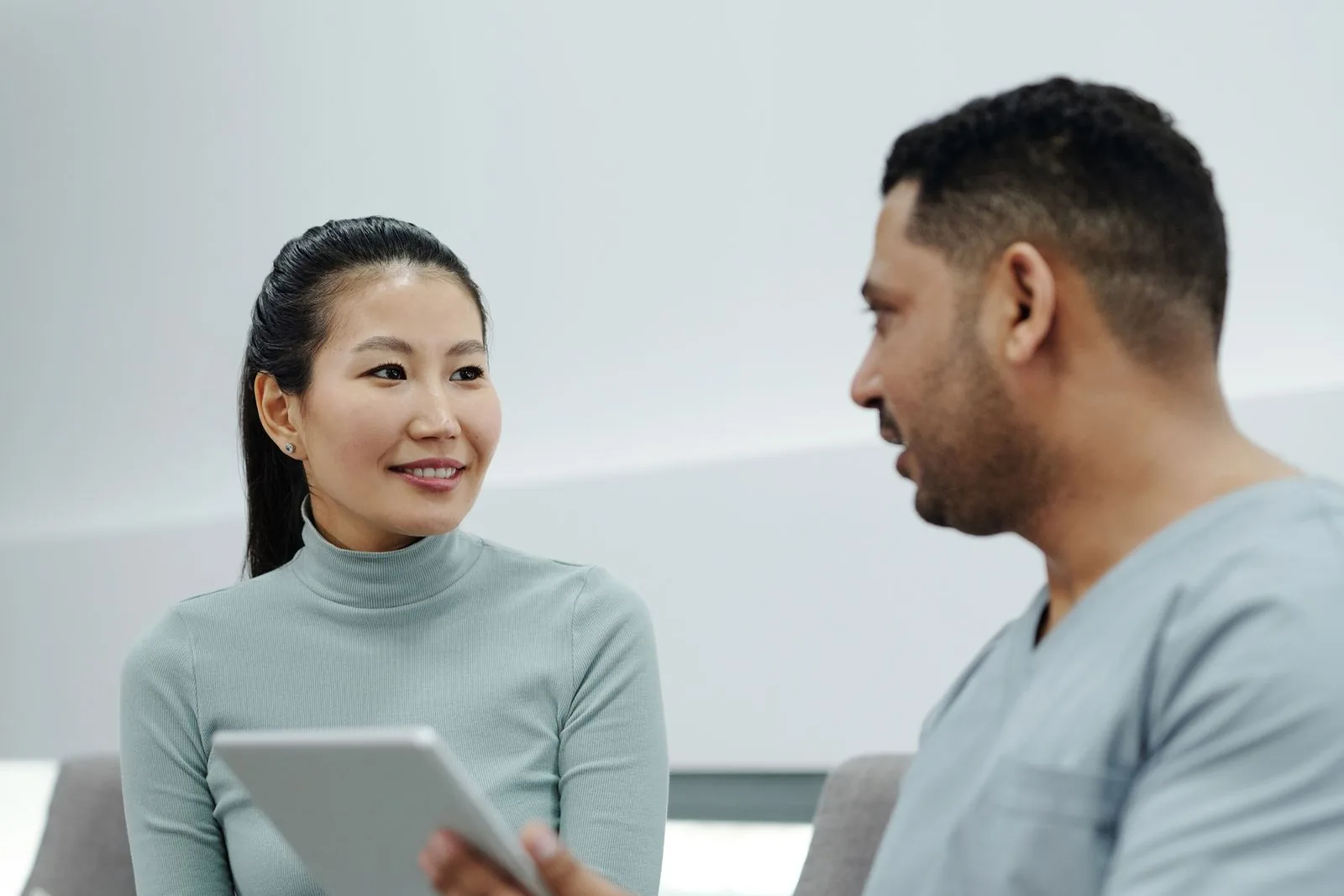 Woman talking through treatment options with her doctor